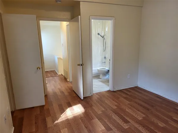 a view of a bathroom from a hallway