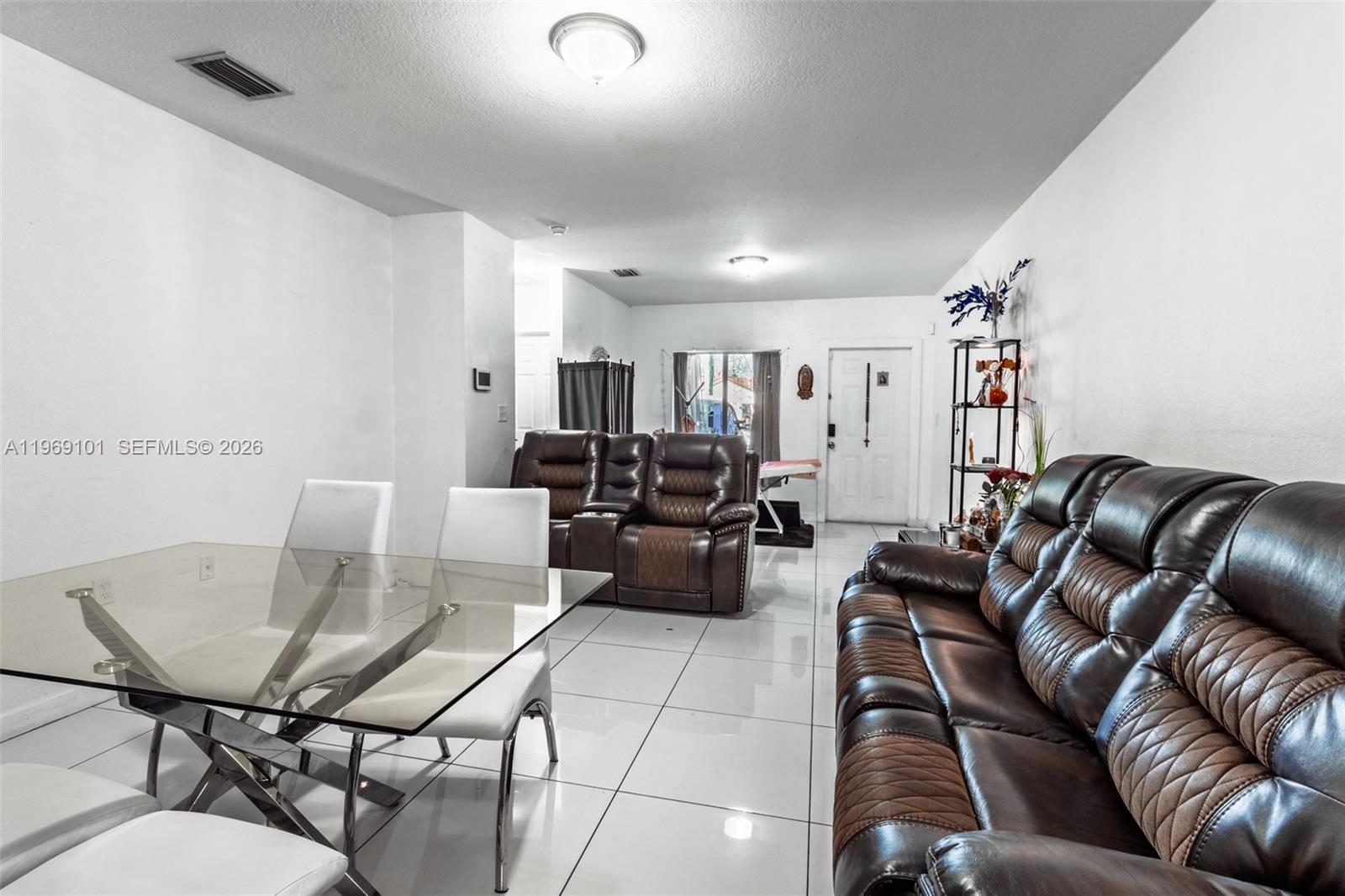 1998 Northwest 47th Street Miami, FL 33142 - Photo 12 of 17 a living room with furniture
