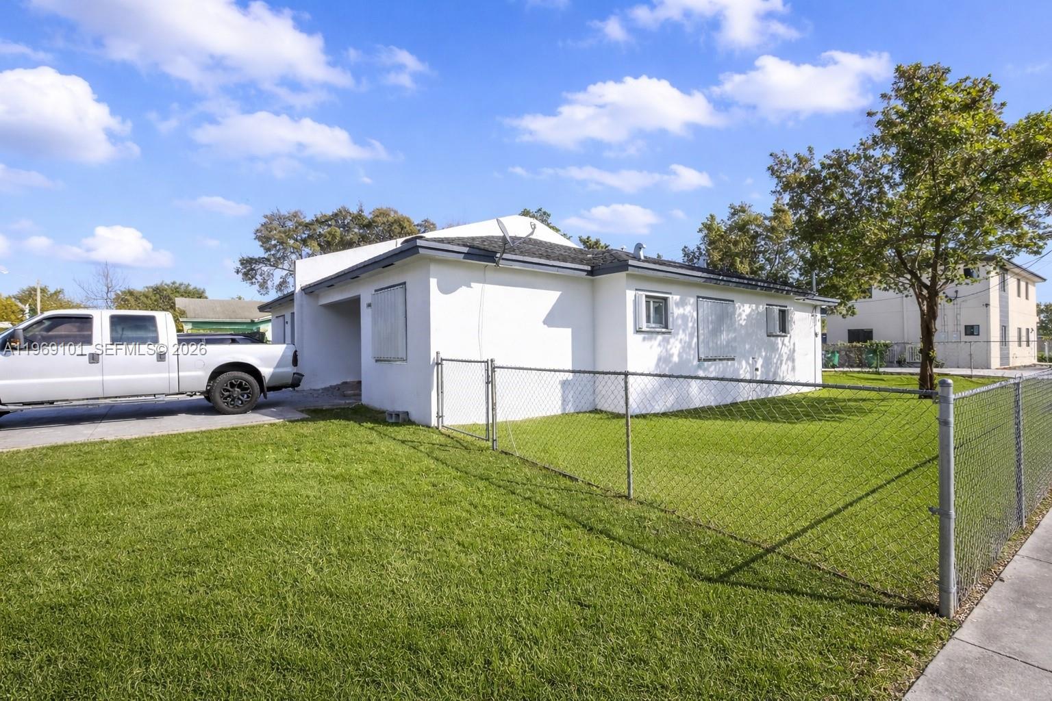1998 Northwest 47th Street Miami, FL 33142 - Photo 17 of 17 a house view with a garden space
