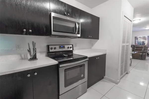 a kitchen with a stove and a microwave