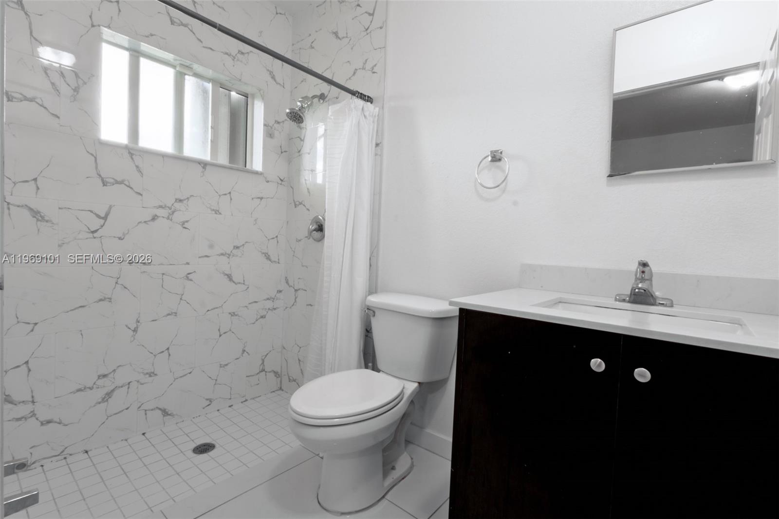 1998 Northwest 47th Street Miami, FL 33142 - Photo 7 of 17 a bathroom with a sink toilet and shower