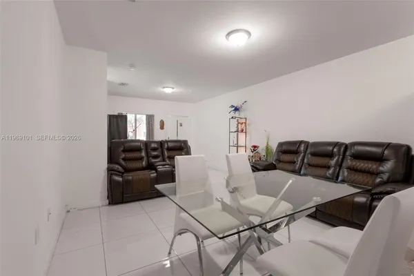 a kitchen with a table and chairs