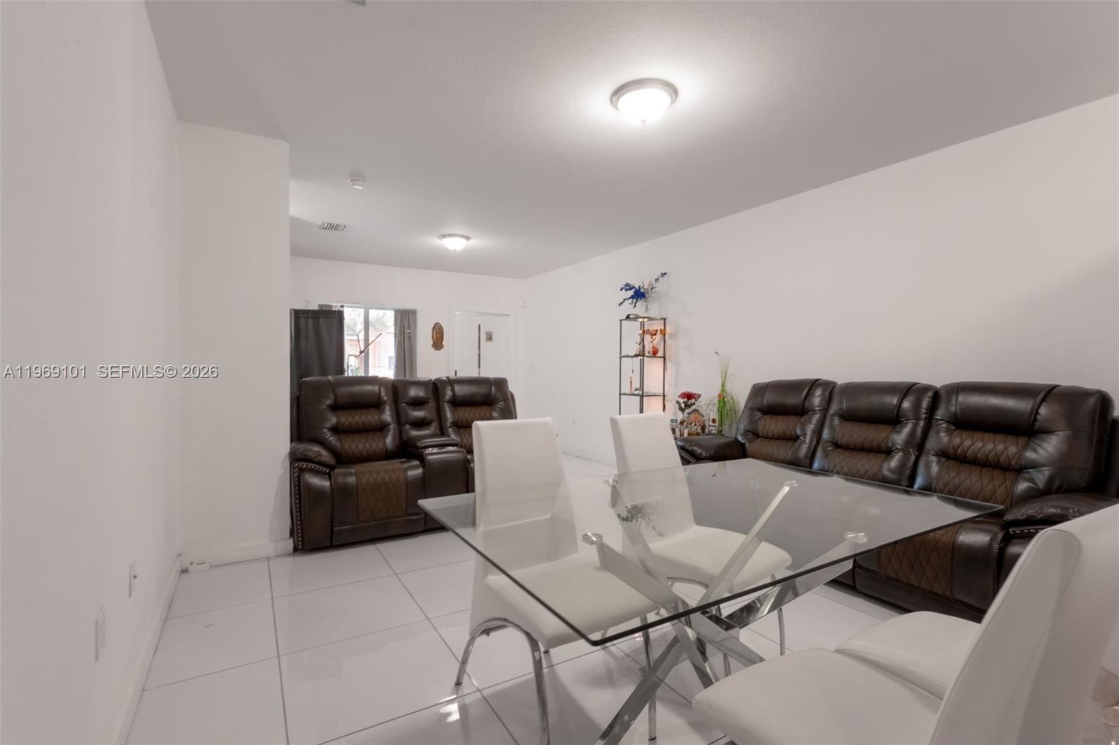 1998 Northwest 47th Street Miami, FL 33142 - Photo 10 of 17 a kitchen with a table and chairs