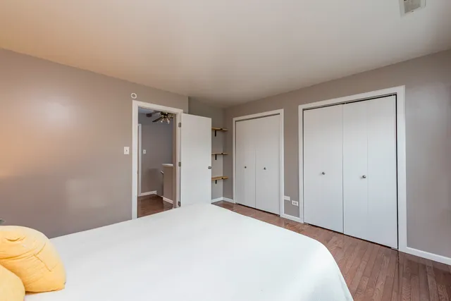 a bedroom with a bed and closet