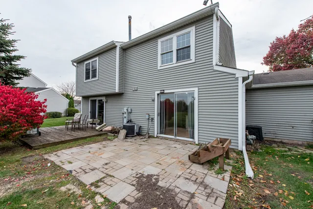 a backyard of a house with seating space