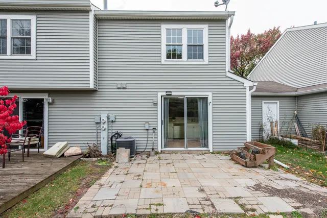 a view of house with backyard space and porch