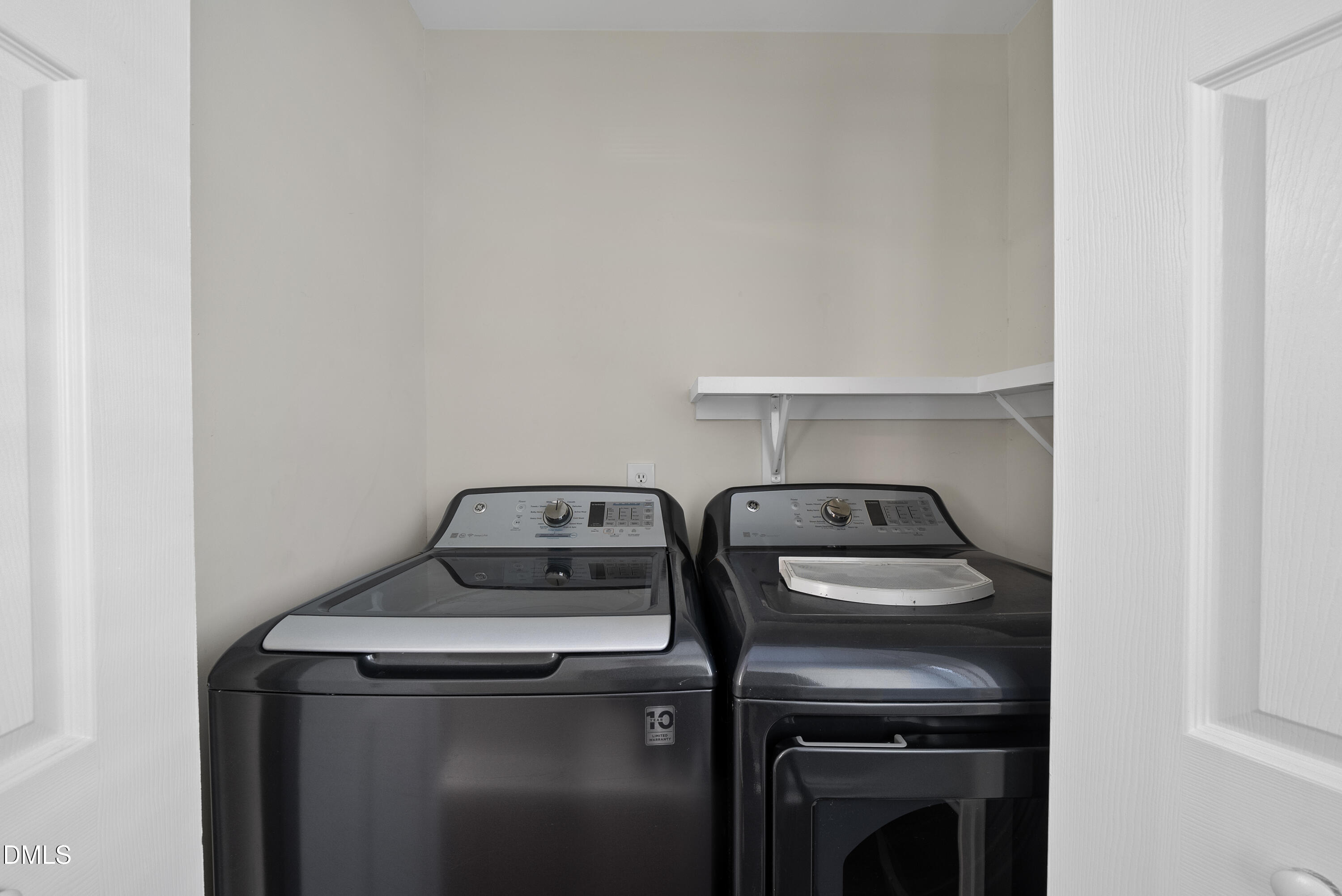 8324 Bellingham Circle Raleigh, NC 27615 - Photo 13 of 34 a view of storage and utility room with washer and dryer