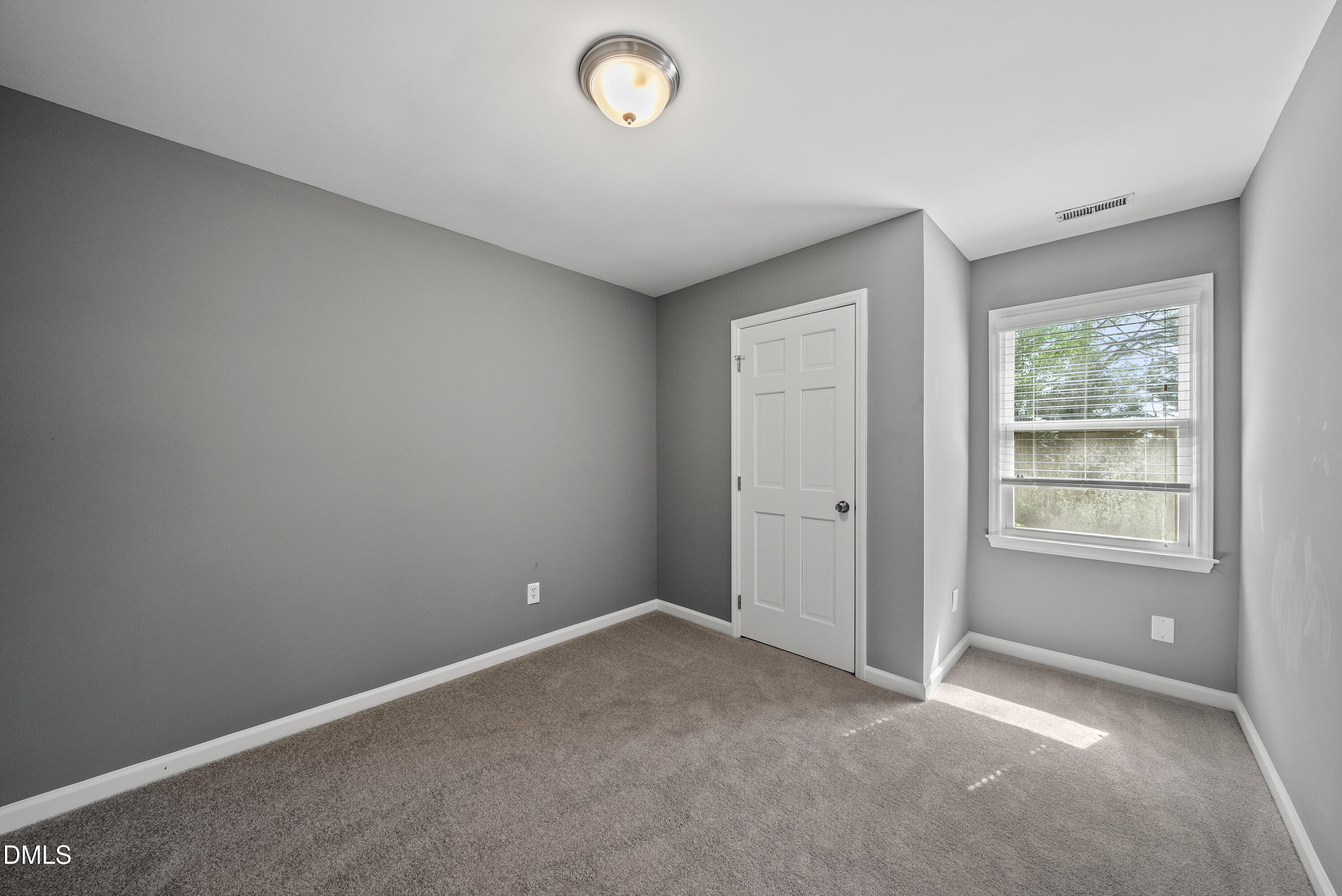 8324 Bellingham Circle Raleigh, NC 27615 - Photo 24 of 34 an empty room with windows
