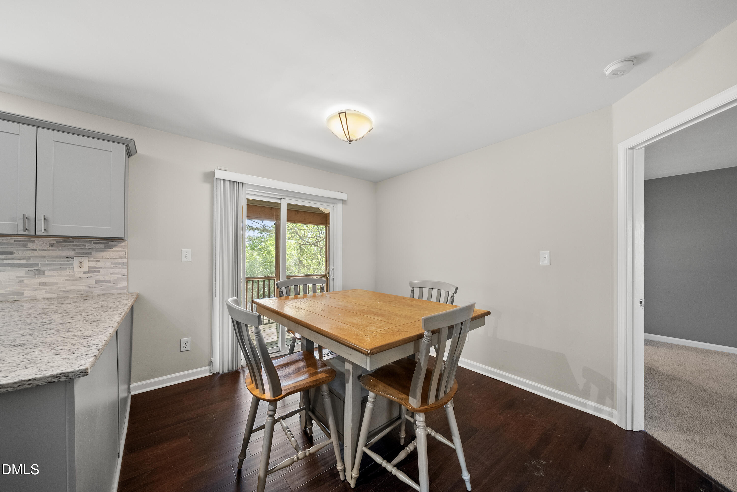 8324 Bellingham Circle Raleigh, NC 27615 - Photo 8 of 34 a view of a dining room with furniture and wooden floor