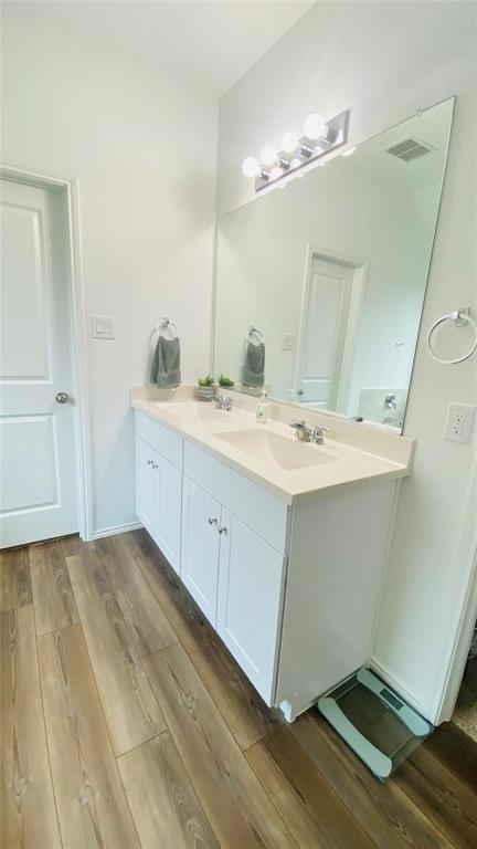 4612 Azurite Road Little Elm, TX 76227 - Photo 11 of 11 a bathroom with a sink and a mirror