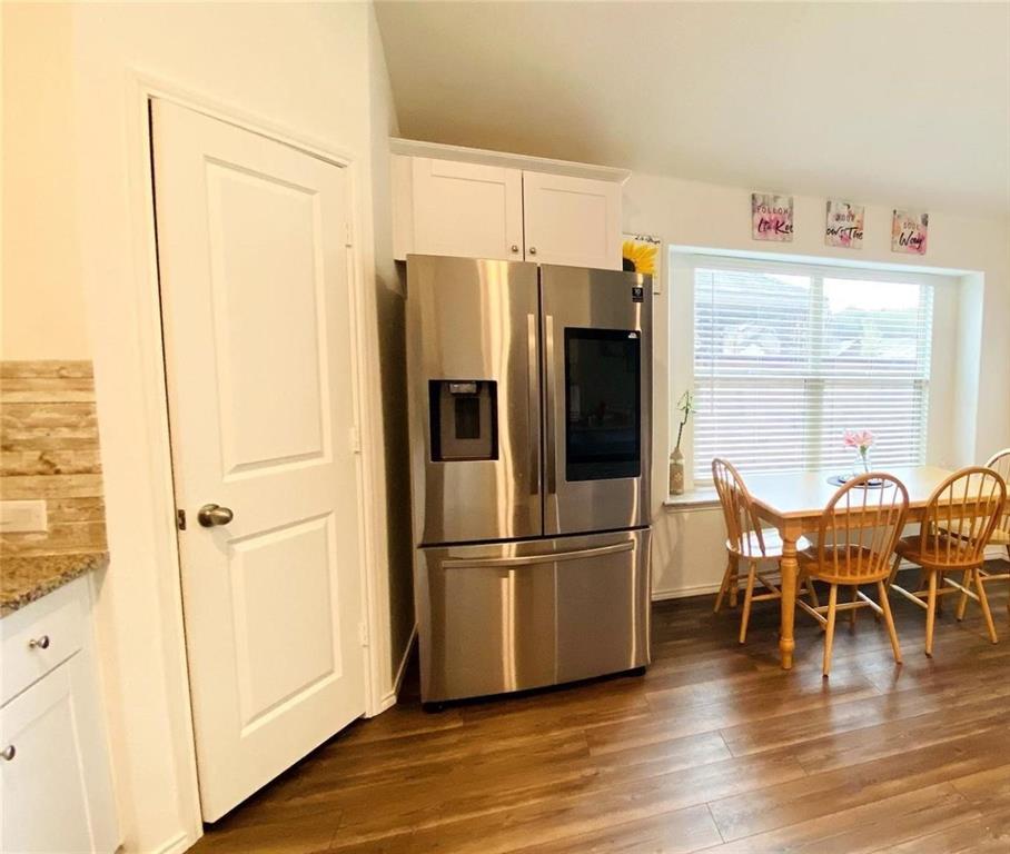 4612 Azurite Road Little Elm, TX 76227 - Photo 2 of 11 a kitchen with stainless steel appliances granite countertop a refrigerator and a stove top oven