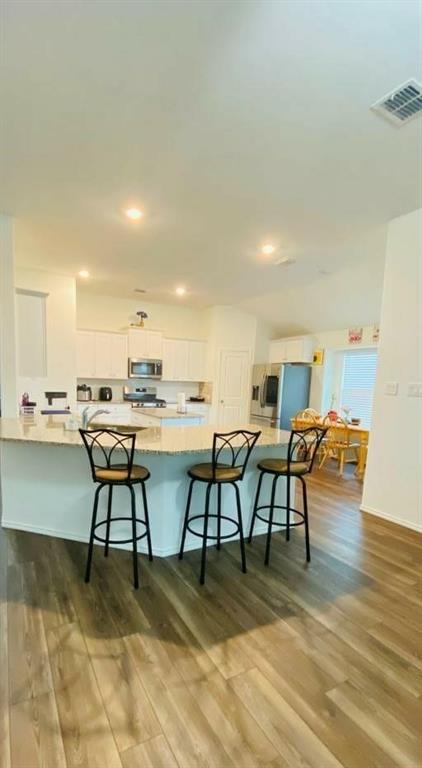 4612 Azurite Road Little Elm, TX 76227 - Photo 4 of 11 a view of a dining room with furniture and wooden floor