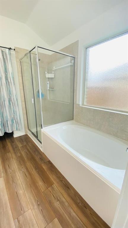 4612 Azurite Road Little Elm, TX 76227 - Photo 9 of 11 a bathroom with a bathtub and a shower