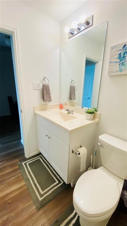 4612 Azurite Road Little Elm, TX 76227 - Photo 10 of 11 a bathroom with a toilet sink and mirror