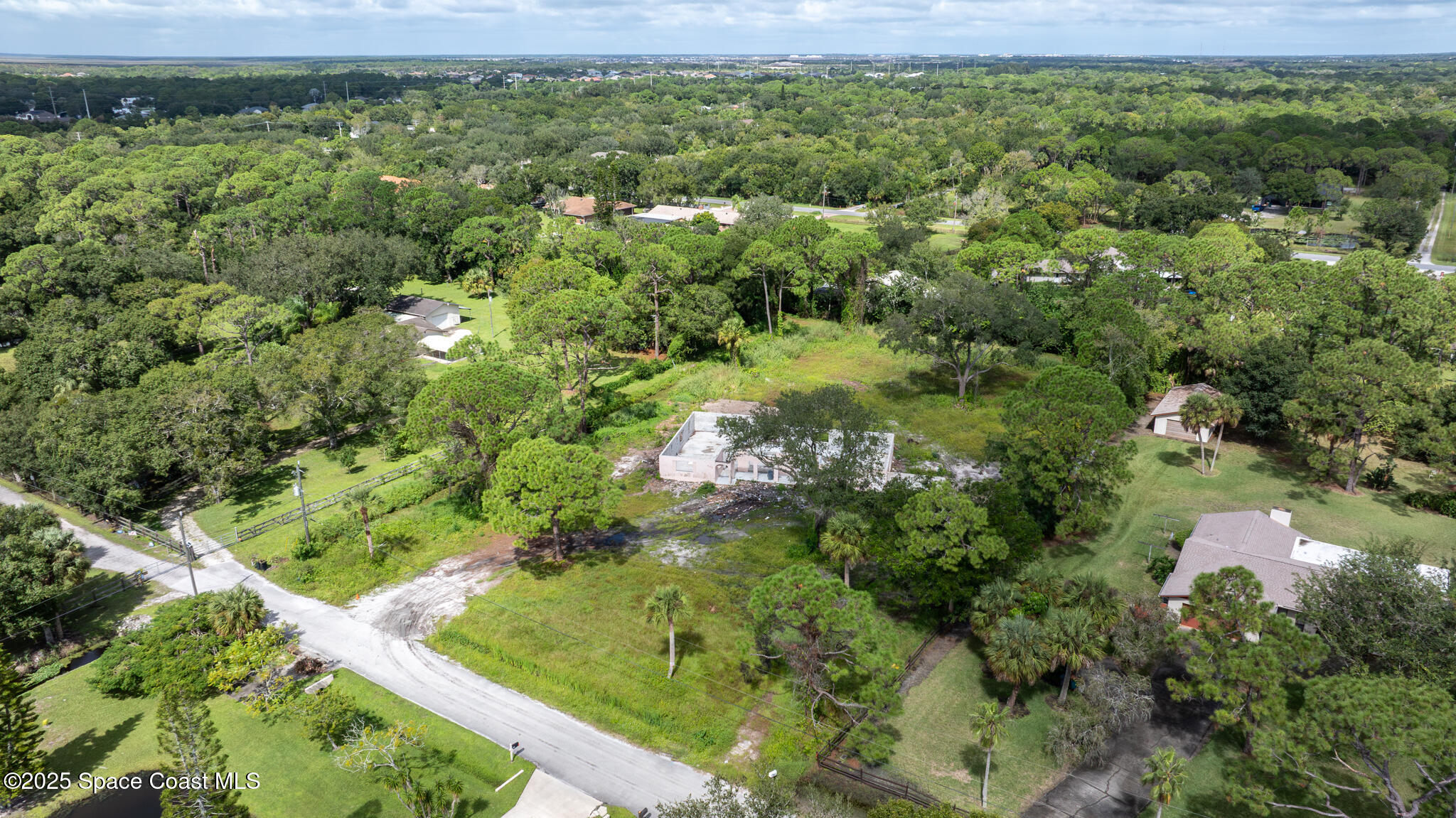 4490 Eldorado Way Melbourne, FL 32934 - Photo 2 of 6 a view of a garden with a lake