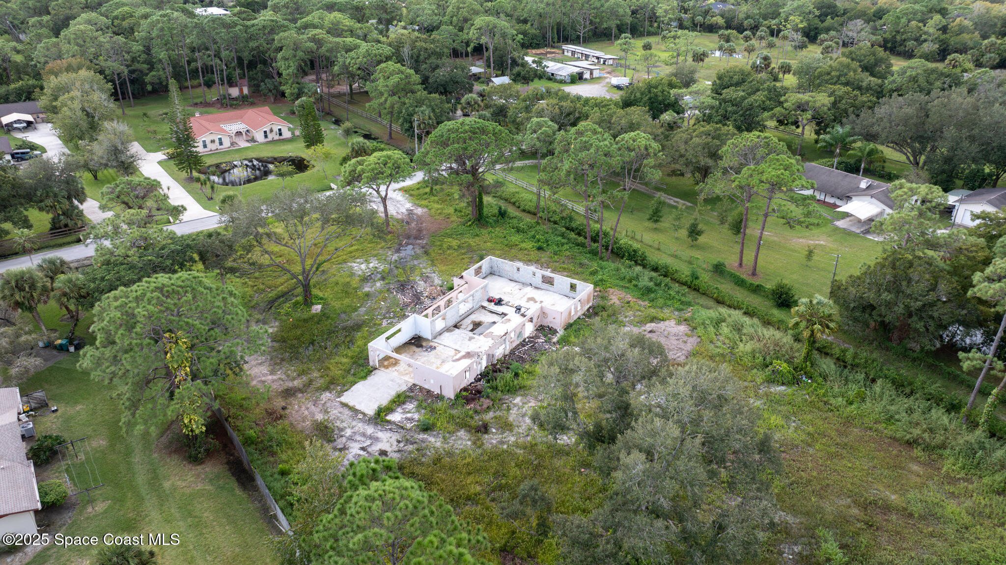 4490 Eldorado Way Melbourne, FL 32934 - Photo 5 of 6 an aerial view of residential houses with outdoor space
