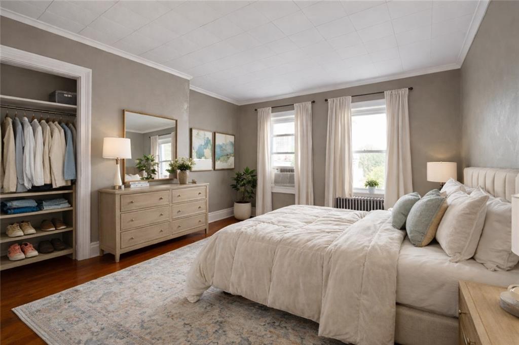 4123 Foster Street Pittsburgh, PA 15201 - Photo 14 of 31 a bedroom with a bed and a dresser