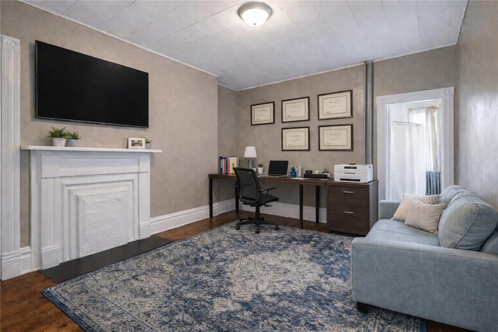 4123 Foster Street Pittsburgh, PA 15201 - Photo 15 of 31 a living room with furniture and a flat screen tv
