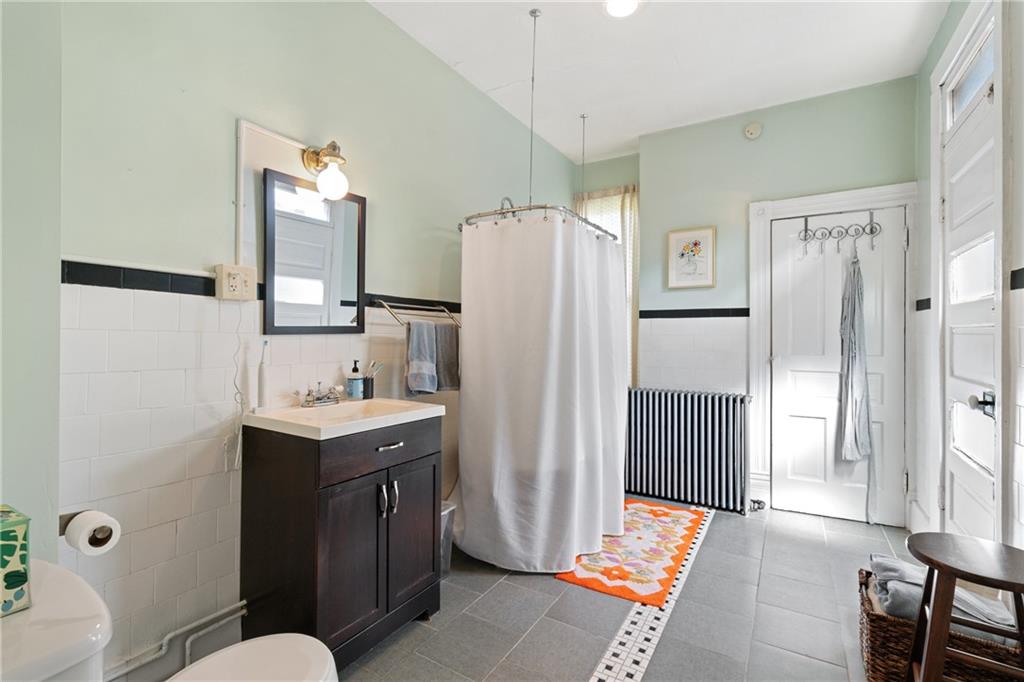 4123 Foster Street Pittsburgh, PA 15201 - Photo 16 of 31 a bathroom with a sink toilet and shower