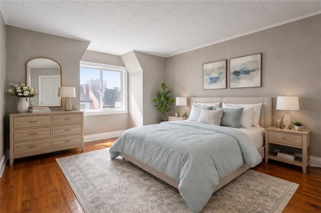 4123 Foster Street Pittsburgh, PA 15201 - Photo 18 of 31 a bedroom with a bed and a dresser