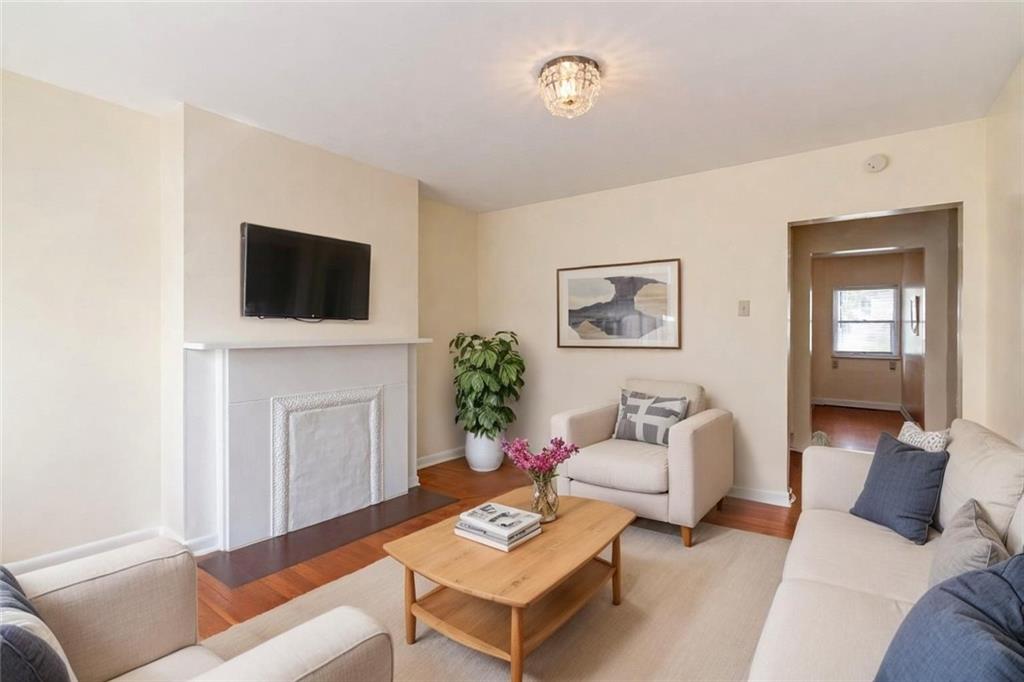 4123 Foster Street Pittsburgh, PA 15201 - Photo 3 of 31 a living room with furniture a flat screen tv and a window