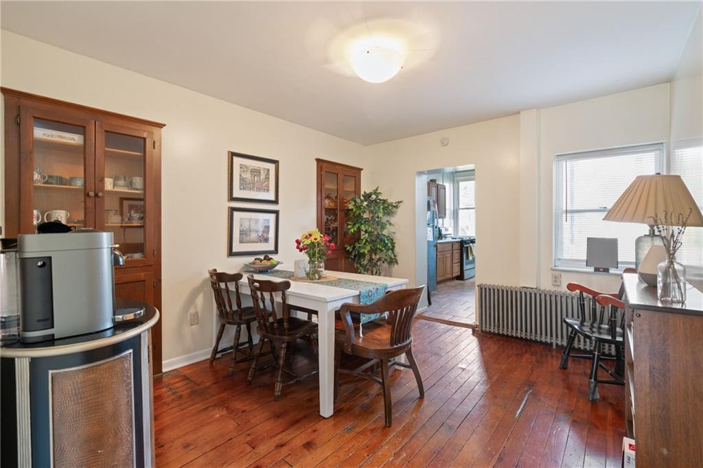 4123 Foster Street Pittsburgh, PA 15201 - Photo 5 of 31 a view of a dining room with furniture and wooden floor
