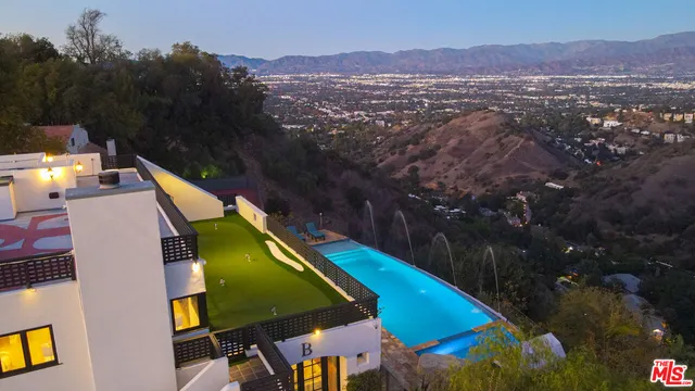 a view of a balcony with an outdoor space and seating area