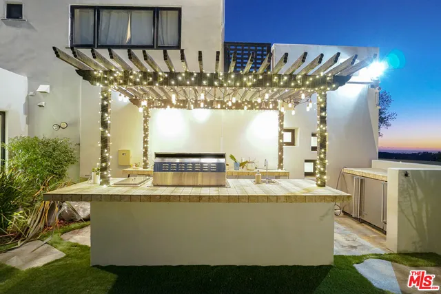 a dining room with furniture and chandelier