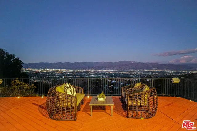 swimming pool view with a lake view
