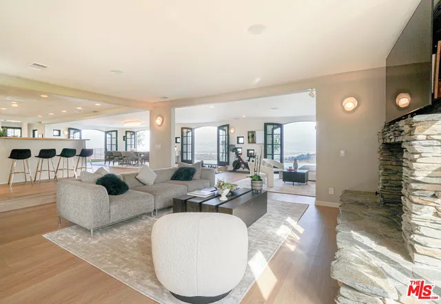 a large living room with large windows