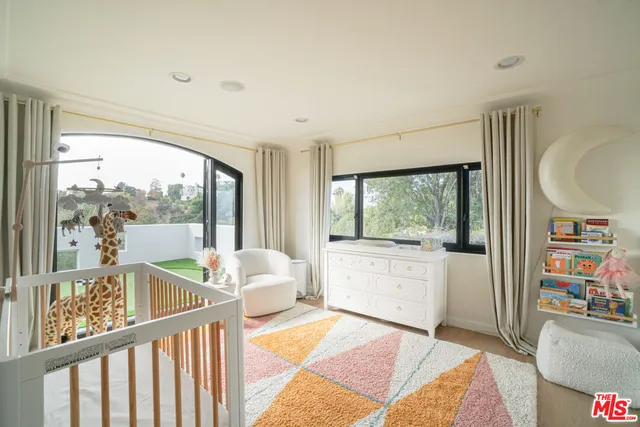 a view of a white house and a yard