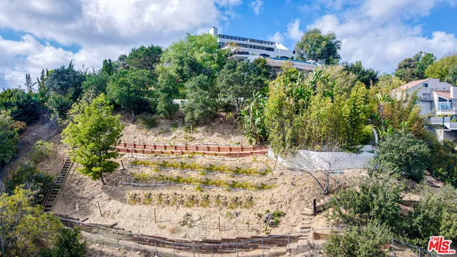 an aerial view of a house with a garden