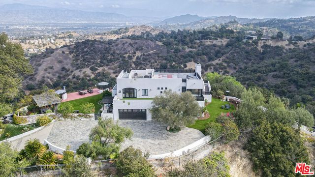 an aerial view of a house with a garden
