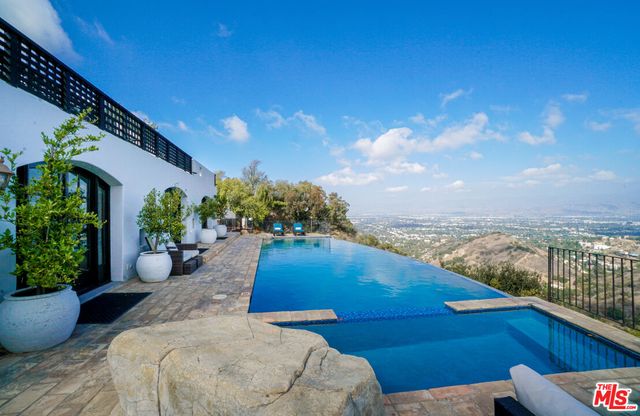 a view of a balcony with furniture