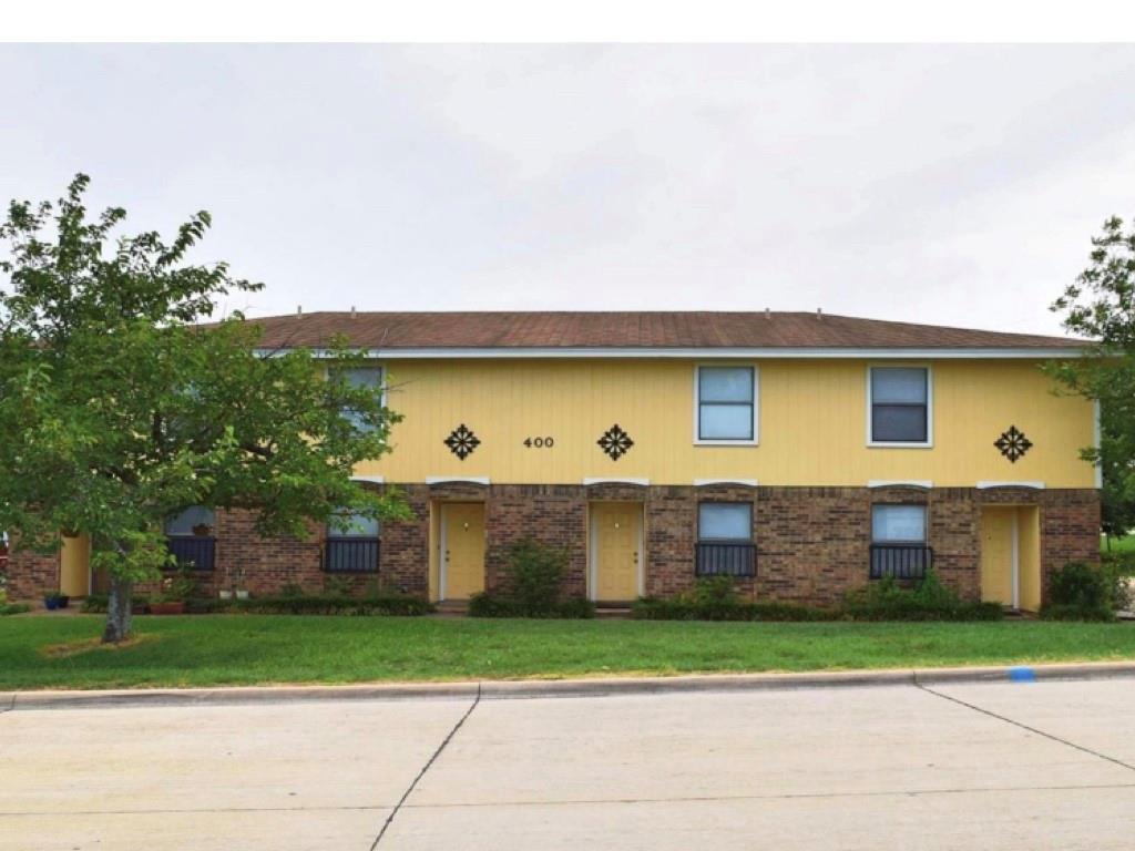 400 Amber Lane, Unit 4 Crowley, TX 76036 - Photo 1 of 1 a front view of a house with a yard