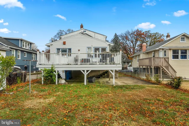 a view of a house with yard and sitting area