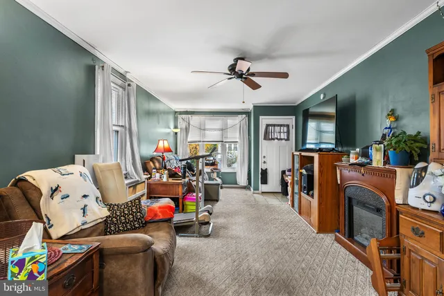 a bedroom with furniture and a flat screen tv