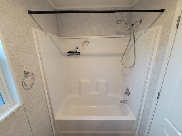 156 Cushing Way Layton, UT 84041 - Photo 12 of 20 Tub and shower combination with white tile-finish surround and textured wall covering
