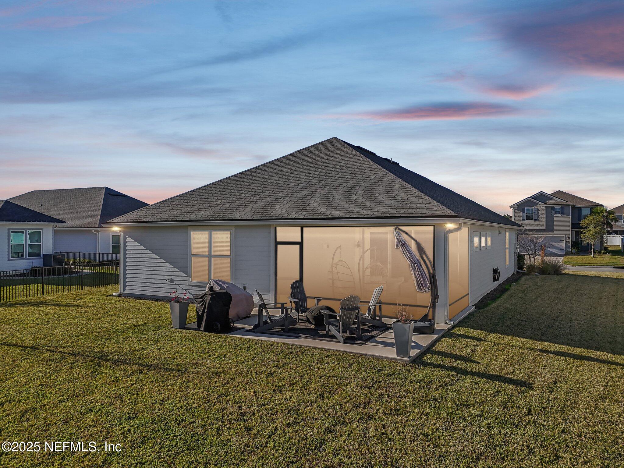 48 Fawn Field Lane St. Augustine, FL 32092 - Photo 4 of 73 a front view of a house with garden