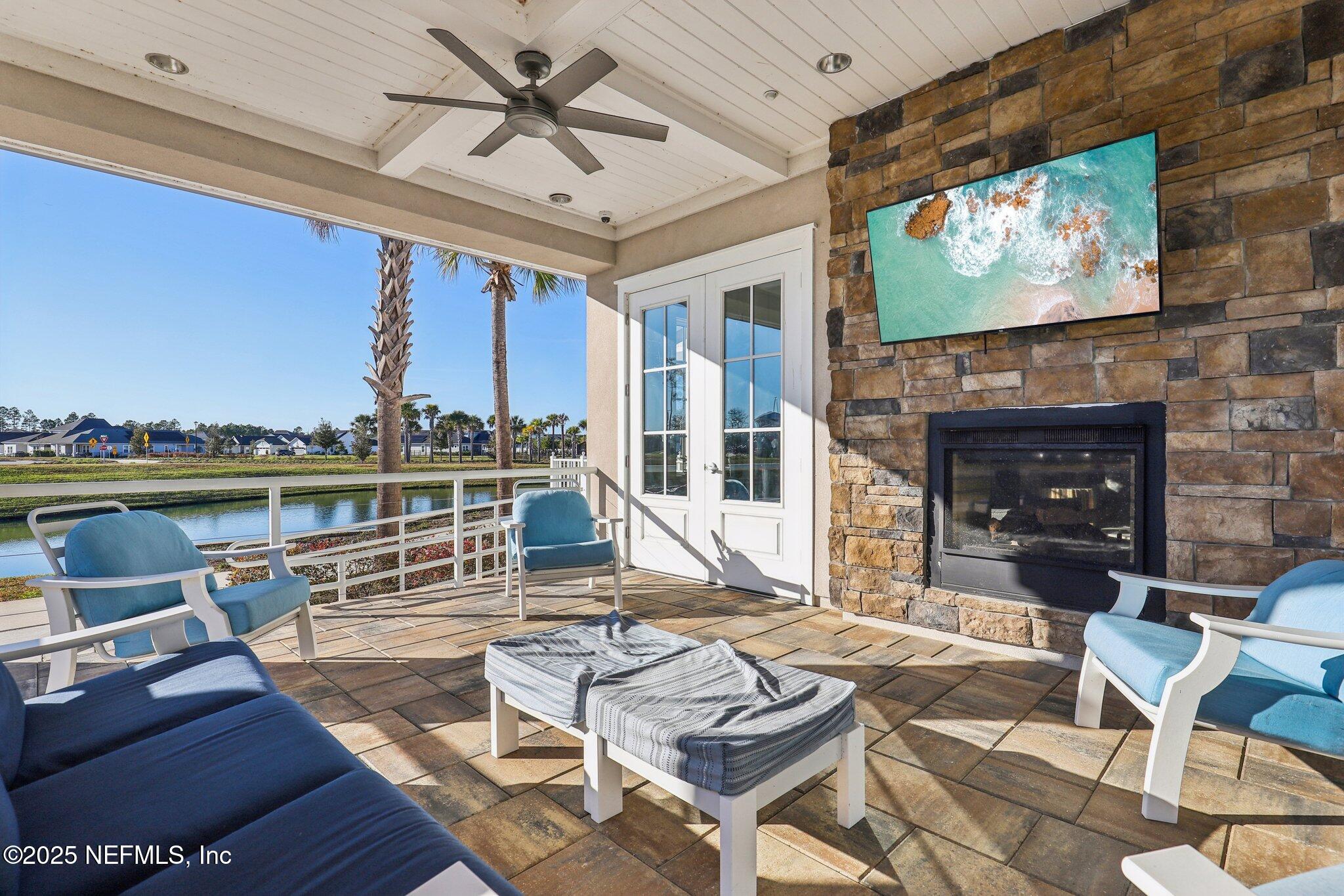 48 Fawn Field Lane St. Augustine, FL 32092 - Photo 66 of 73 a living room with furniture a fireplace and a flat screen tv
