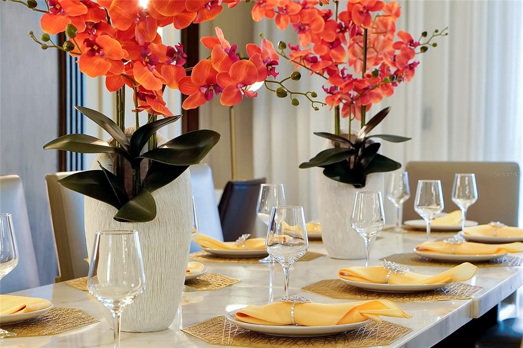 4494 Kaipo Road Davenport, FL 33897 - Photo 19 of 100 a vase of flowers sitting on a table with a mirror