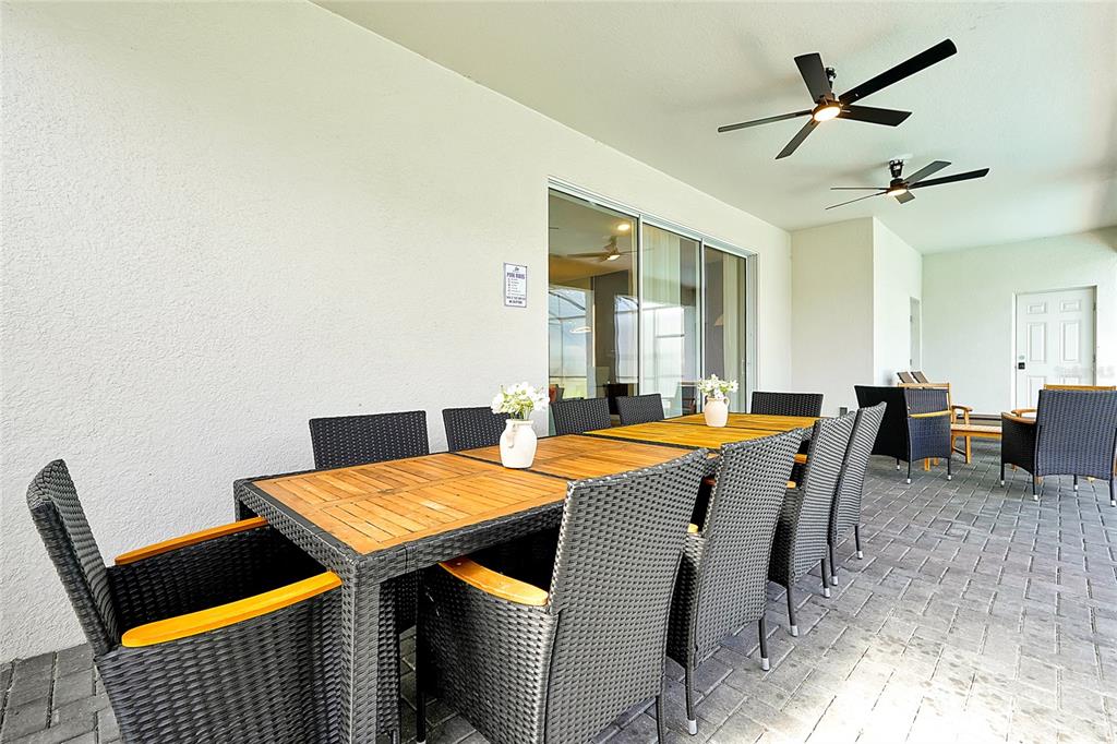 4494 Kaipo Road Davenport, FL 33897 - Photo 22 of 100 a view of a dining room with furniture