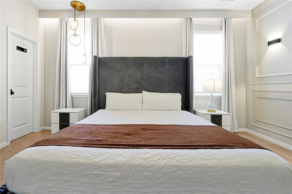 4494 Kaipo Road Davenport, FL 33897 - Photo 34 of 100 a bedroom with a bed and a window