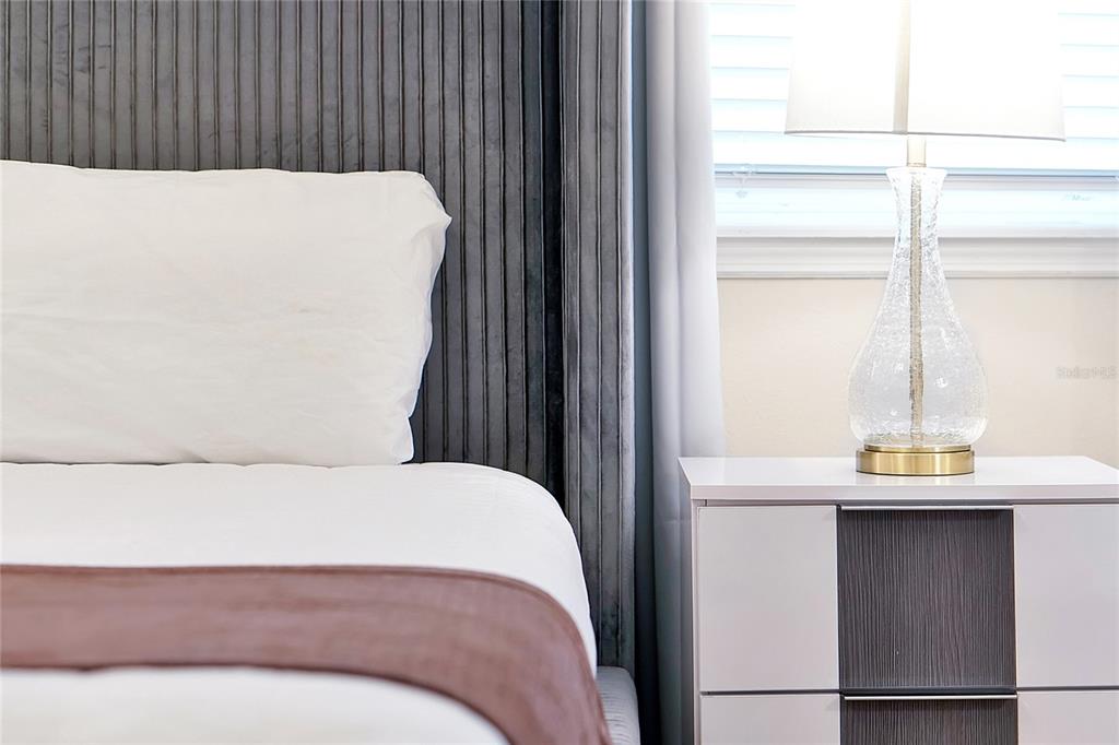 4494 Kaipo Road Davenport, FL 33897 - Photo 36 of 100 a bedroom with a bed and a window