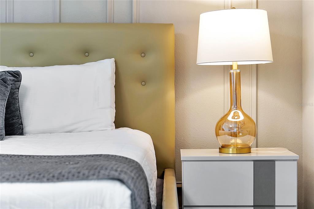 4494 Kaipo Road Davenport, FL 33897 - Photo 87 of 100 a bedroom with a bed and a table