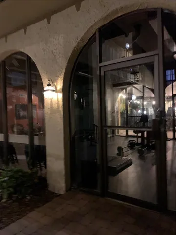 a view of water heater room with wooden floor