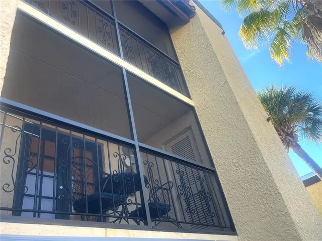 a view of balcony with wooden floor