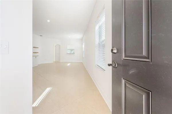 a view of a hallway with a white walls