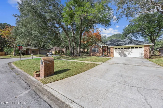 wooden floor in an empty room with a fireplace