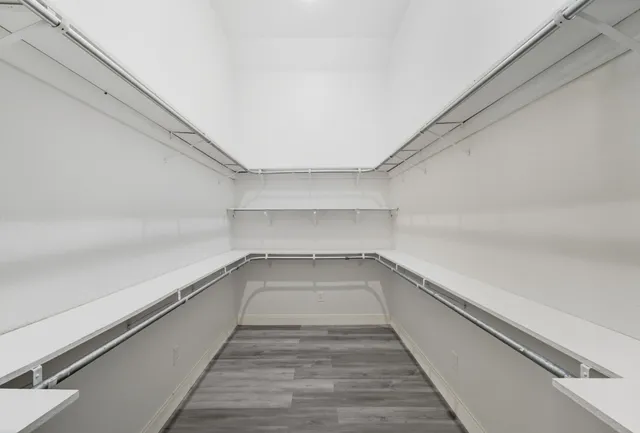 a bathroom with a granite countertop sink a mirror and a